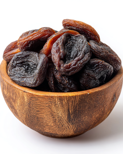 aviv8941_Dried_dark_brown_apricots_in_a_wooden_bowl_on_a_white__4322bc01-8511-4859-a54f-35a3c668b25c